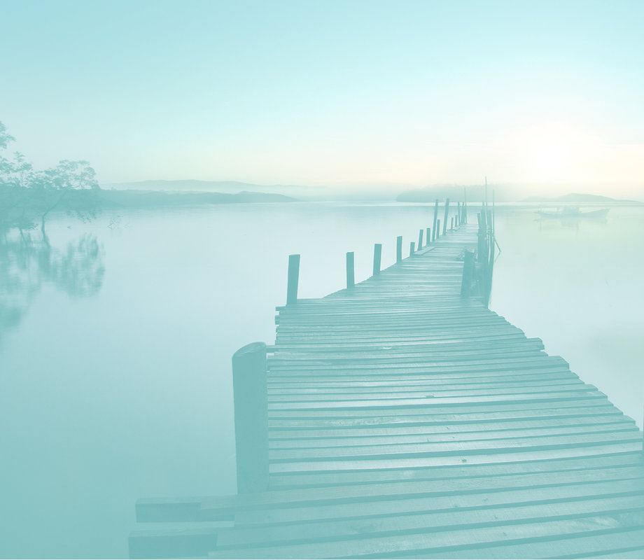 Bridge over a lake representing assisted living support